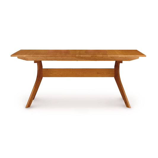 Audrey Extension Dining Table by Copeland Furniture, crafted from solid cherry wood with distinctive angled legs and a sturdy support beam.