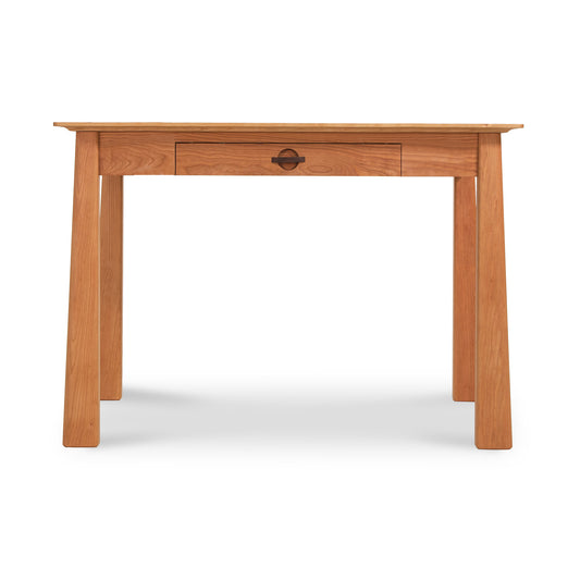 Cherry Moon Writing Desk by Maple Corner Woodworks in solid wood with light finish, straight legs, and single center drawer with round handle.