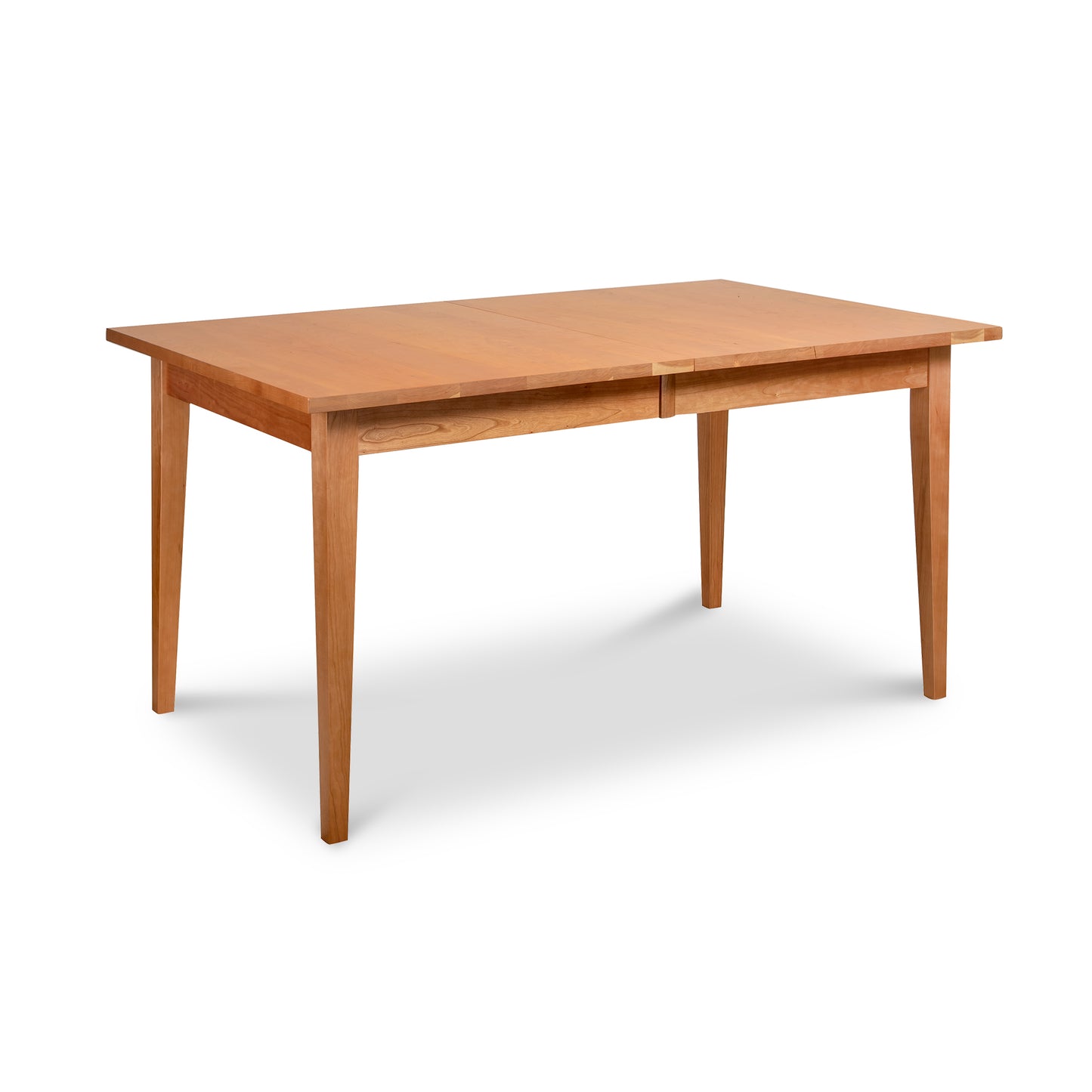 Lyndon Furniture Classic Shaker Extension Dining Table with four tapered legs and a classic, minimalist silhouette in fine hardwood.