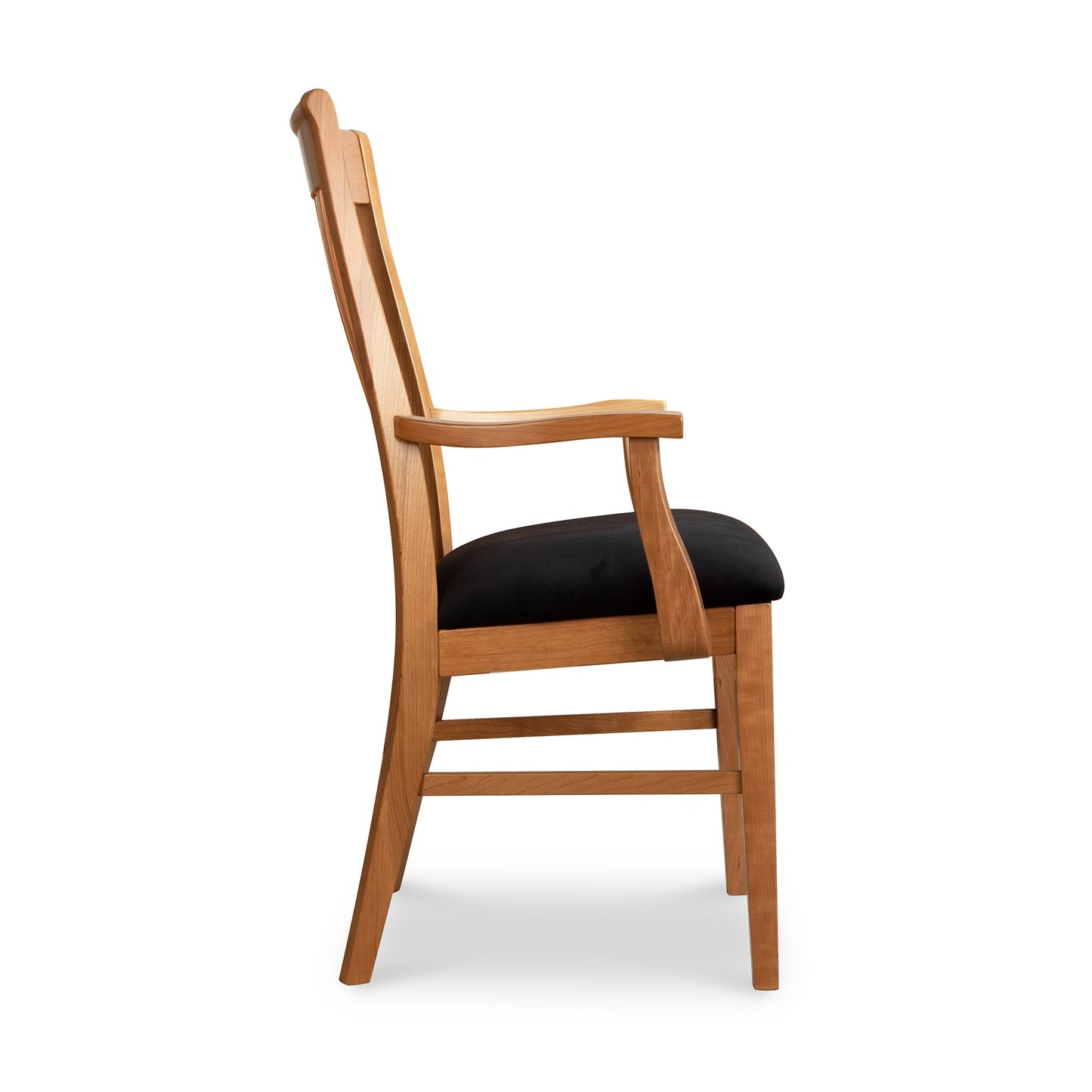 Vermont Woods Studios Country Shaker Arm Chair with black upholstered seat and ergonomic solid wood frame, side view.