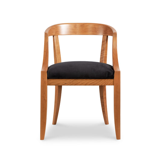 Dorset Chair with sleek design, curved backrest, armrests, and black cushioned seat showcasing modern elegance from Vermont Woods Studios.