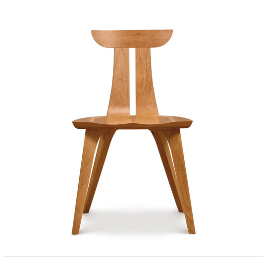 Estelle Chair by Copeland Furniture with a curved back and angular legs, crafted from solid American hardwood for a sleek, modern look.