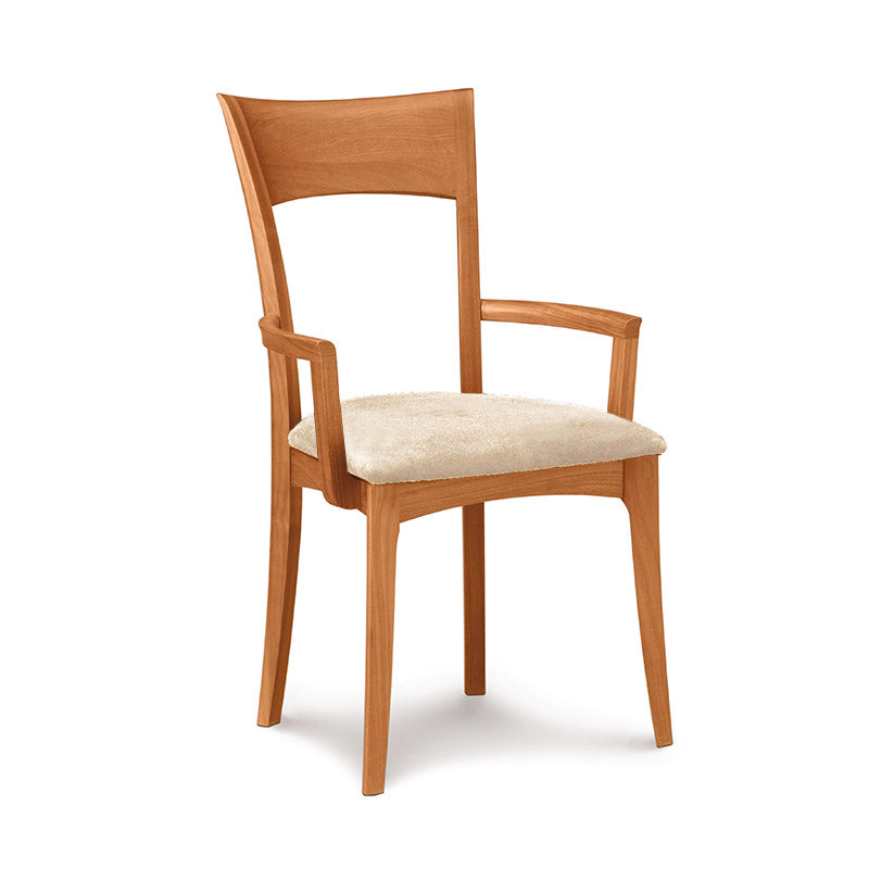Ingrid Shaker Arm Chair by Copeland Furniture in solid cherry wood with high back, curved arms, and beige cushion. Premium American made craftsmanship.