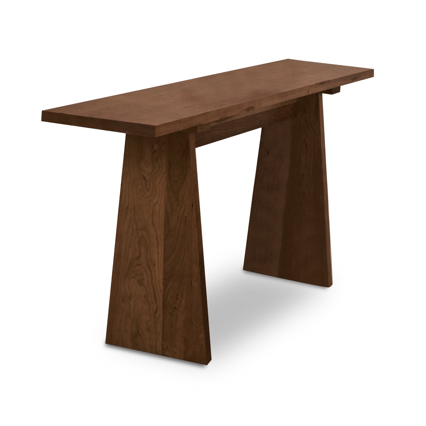 Lyndon Furniture Modern Designer Sofa Table with thick solid wood top and two distinctive trapezoidal legs, highlighting its contemporary design.