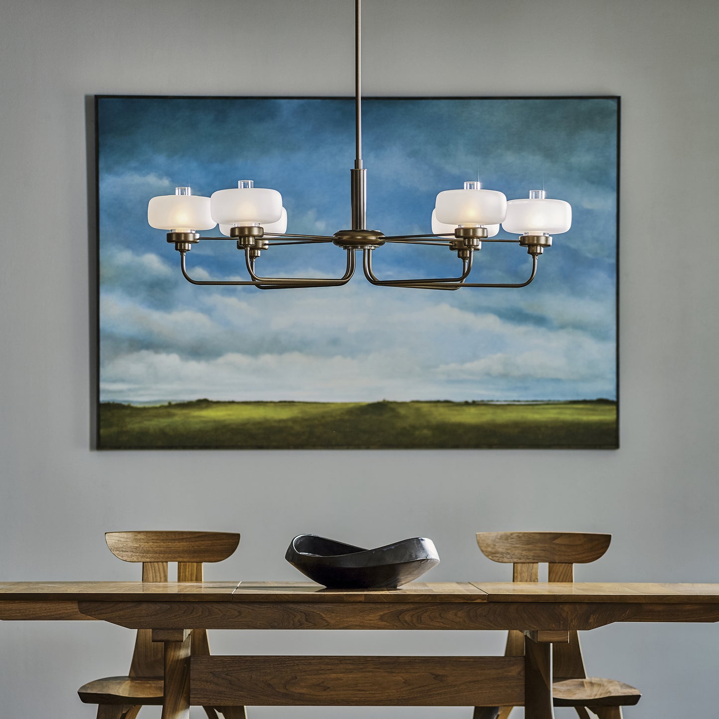 High-quality wooden dining table with black bowl centerpiece.