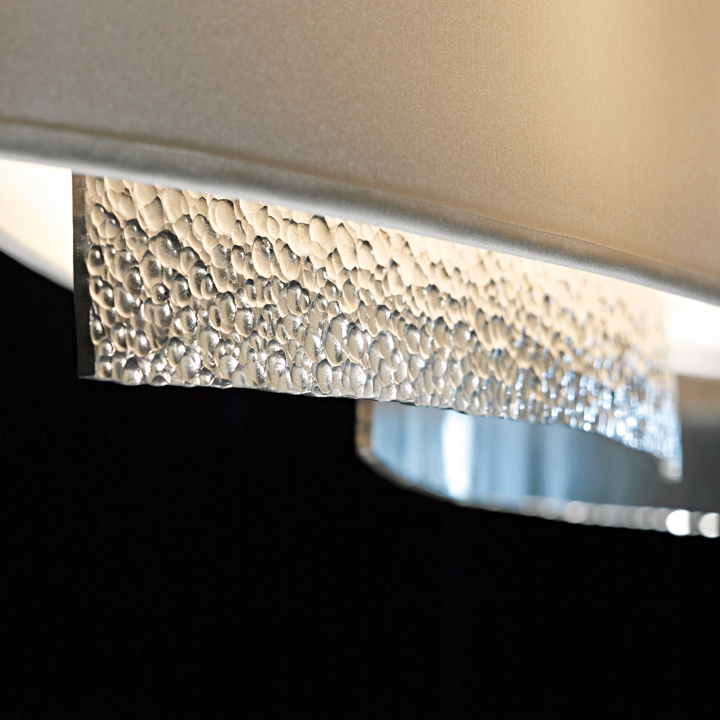 Oceanus Pendant by Hubbardton Forge with a textured metallic finish and intricate raised bumps showcasing elegant craftsmanship.