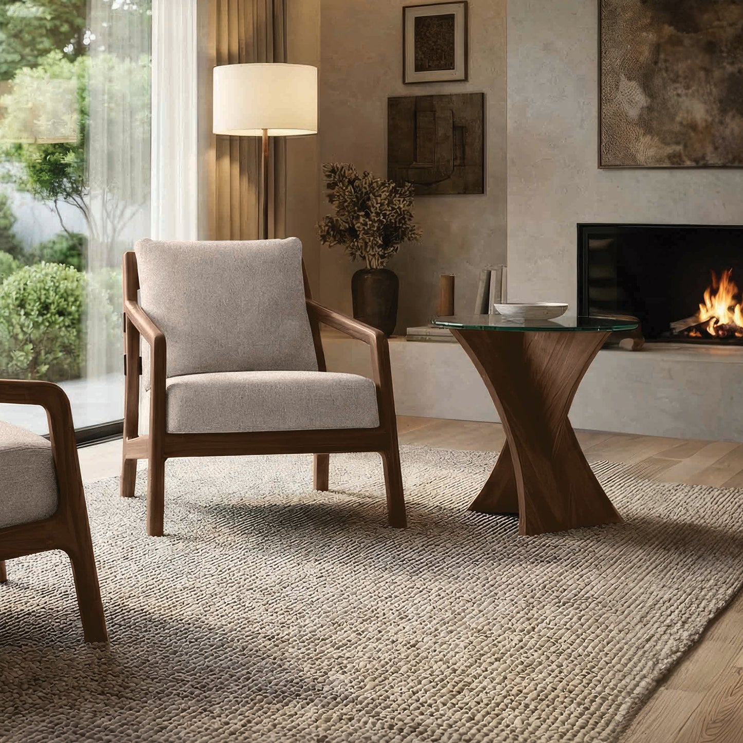 Beige armchair and Copeland Planes glass end table, crafted in the USA, are featured as the focal furniture pieces in a modern living room.