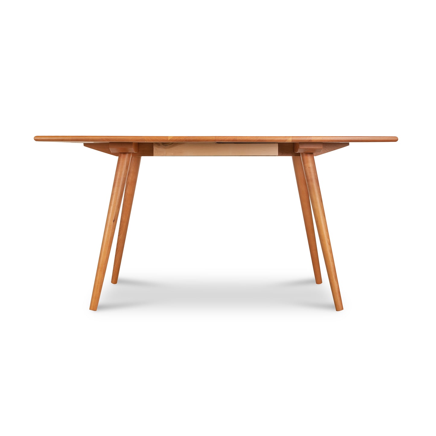 Lyndon Furniture Addison Boat Top Extension Dining Table with mid-century modern angled legs.