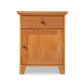 American Country Nightstand by Lyndon Furniture with natural finish, round knobs, 1 drawer, and cabinet.