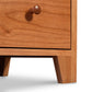 American Country 5-Drawer Chest by Lyndon Furniture with detailed view of dovetail drawer, round knob, and solid wood grain.