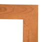 Lyndon Furniture American Country Mirror featuring a detailed view of its solid wood frame, highlighting the grain and precise miter joints.