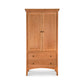 American Shaker Armoire from Maple Corner Woodworks, crafted from solid wood with a natural finish, two doors and two drawers with round knobs, showcasing timeless style and functionality.