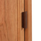 Andover Modern 1-Drawer Nightstand with Door featuring a vertical dark handle, highlighting the hardwood grain texture of this eco-friendly, handcrafted furniture piece.
