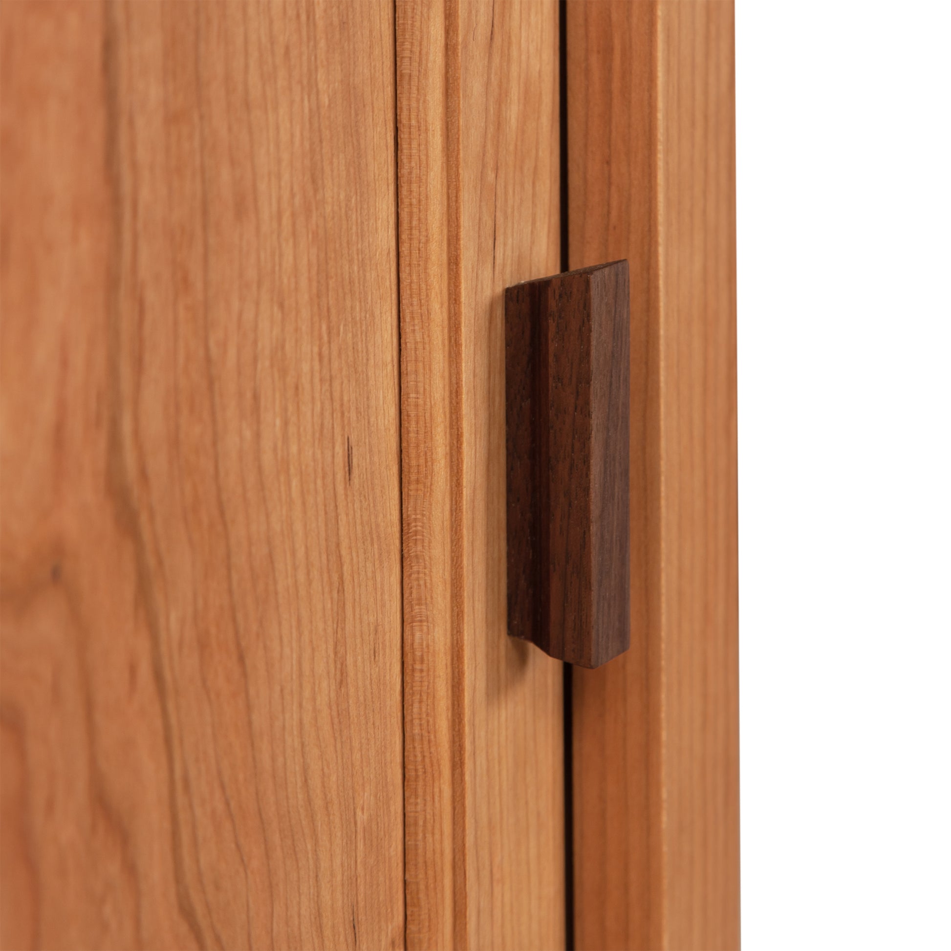 Andover Modern 1-Drawer Nightstand with Door featuring a vertical dark handle, highlighting the hardwood grain texture of this eco-friendly, handcrafted furniture piece.
