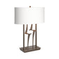Antasia #1 Table Lamp by Hubbardton Forge with a bronze base, artistic metal accents, and a rectangular white shade.