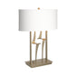 Antasia #1 Table Lamp by Hubbardton Forge with a handcrafted sculptural gold base and white shade, showcasing elegant American-made furniture design.