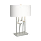Antasia #1 Table Lamp by Hubbardton Forge with a sculptural metallic base and white rectangular shade, showcasing modern handcrafted design.