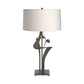 Antasia #2 Table Lamp with sculptural forged metal base and white cylindrical shade, crafted by Hubbardton Forge.