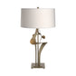 Antasia #2 Table Lamp by Hubbardton Forge with a sculptural gold base and white cylindrical shade, showcasing handcrafted American furniture design.