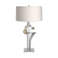 Antasia #2 Table Lamp by Hubbardton Forge with sculptural metallic base and white drum shade, showcasing elegant craftsmanship and modern design.