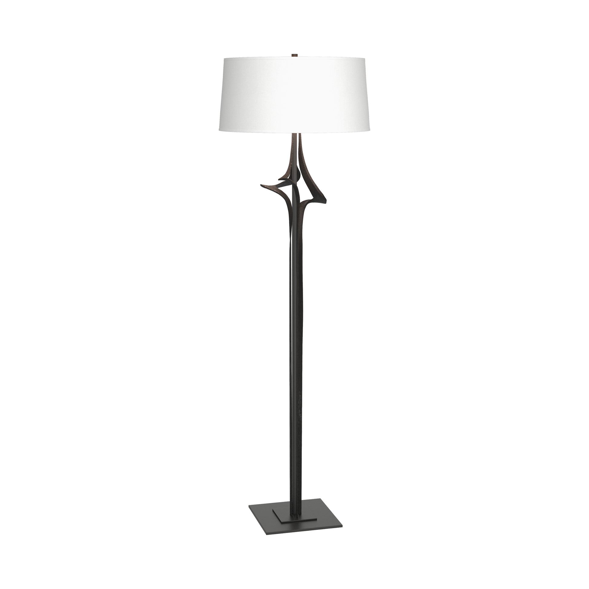 Hubbardton Forge Antasia Floor Lamp with handcrafted metal frame, white drum shade, and slender dark stand on a square base.