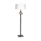 Antasia Floor Lamp by Hubbardton Forge with a white drum shade and sculpted metallic base, showcasing elegant American-made craftsmanship.
