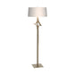 Antasia Floor Lamp by Hubbardton Forge with a tall metallic stand, branch-inspired detail, square base, and white drum shade.