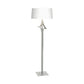 Antasia Floor Lamp by Hubbardton Forge with a sculptural metallic stem, square base, and white drum shade, showcasing elegant modern design.