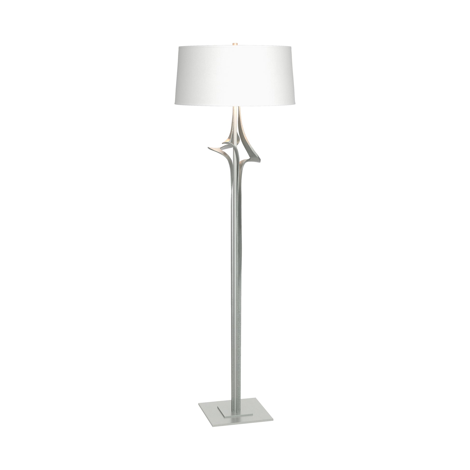 Antasia Floor Lamp by Hubbardton Forge with a sculptural metallic stem, square base, and white drum shade, showcasing elegant modern design.