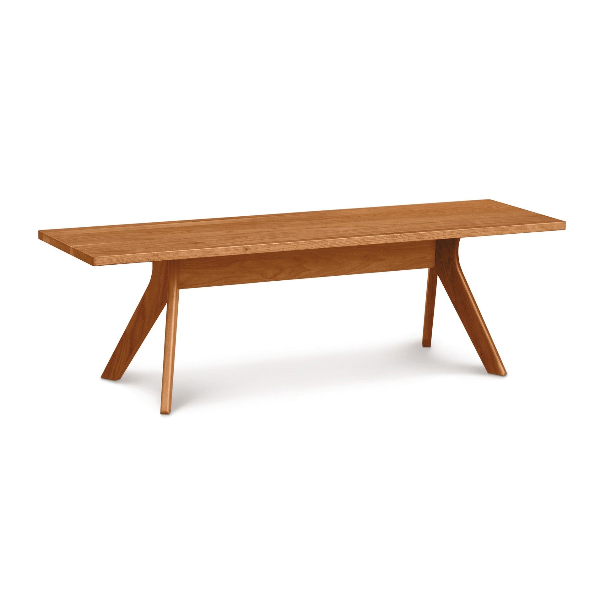 Audrey Dining Bench by Copeland Furniture made from solid cherry wood, showcasing a modern rectangular seat and distinctive angled legs.