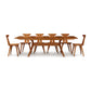 Audrey Extension Dining Table by Copeland Furniture with six mid-century modern chairs, showcasing elegant American craftsmanship.