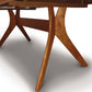 Audrey Extension Dining Table by Copeland Furniture, showcasing handcrafted solid wood top and distinctive angular crossed legs.