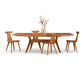 Copeland Furniture Audrey Extension Dining Table with four matching chairs, handcrafted in Vermont, displayed with simple tabletop decor.