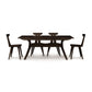 Audrey Extension Dining Table by Copeland Furniture with four angled-leg chairs, showcasing American-made craftsmanship and modern design.