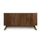 Audrey 4-Door Buffet by Copeland Furniture shown in solid wood with angled legs and vertical handles, highlighting its sleek modern design.