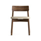 Copeland Furniture Baton Chair featuring a beige cushion and elegant curved backrest, shown from the front. American made hardwood craftsmanship.