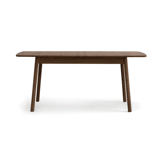 Copeland Baton Extension Dining Table with Mid-Century curves and angled legs, crafted in solid wood and American made.