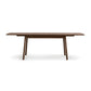 Baton Extension Dining Table by Copeland Furniture with rounded corners and angled legs, crafted in American-made hardwood, focus on table.