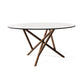 Baton Round Glass Top Table by Copeland Furniture with elegant intersecting wooden legs, highlighting American craftsmanship.