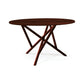 Baton Round Solid Top Dining Table by Copeland Furniture with angled legs, crafted in solid wood, showcasing modern American-made quality.