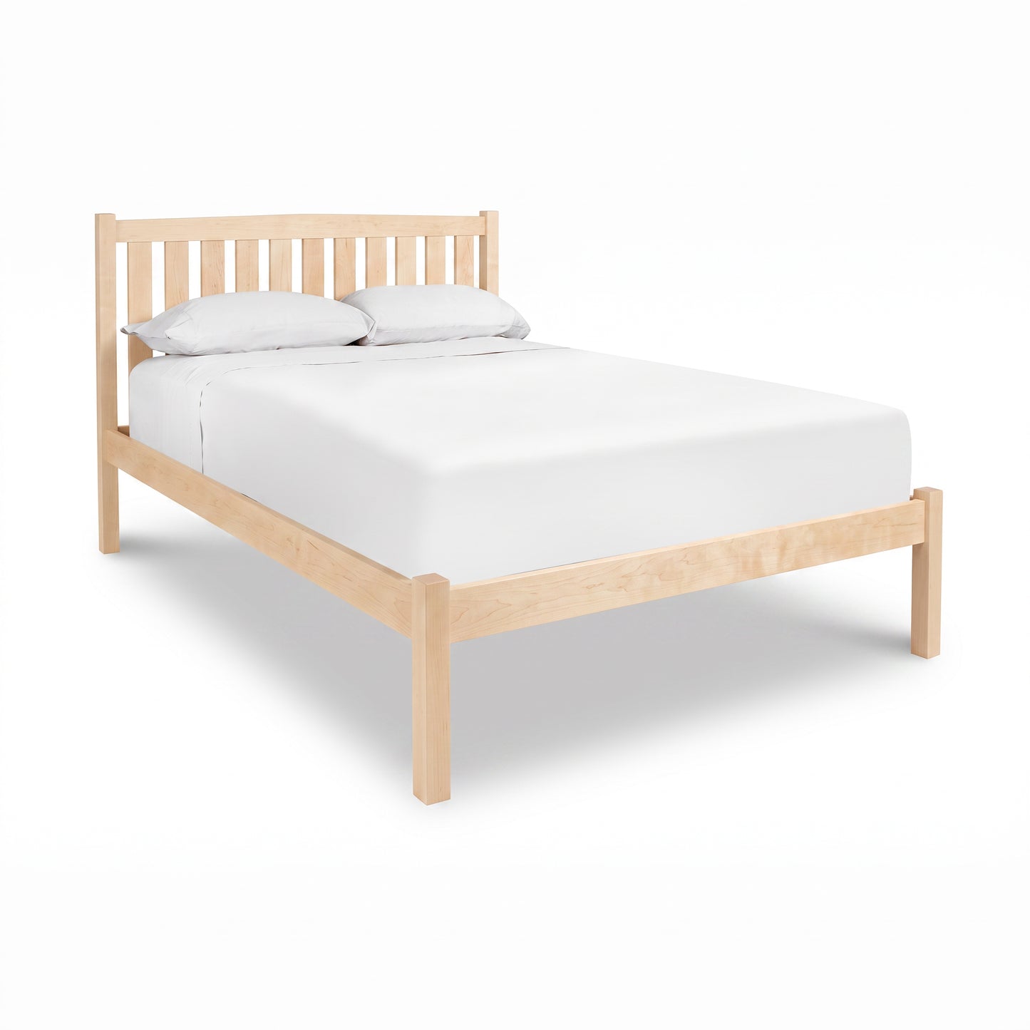 Bennington Bed with Low Footboard by Vermont Furniture Designs featuring a crisp white mattress and pillows, crafted in solid wood.