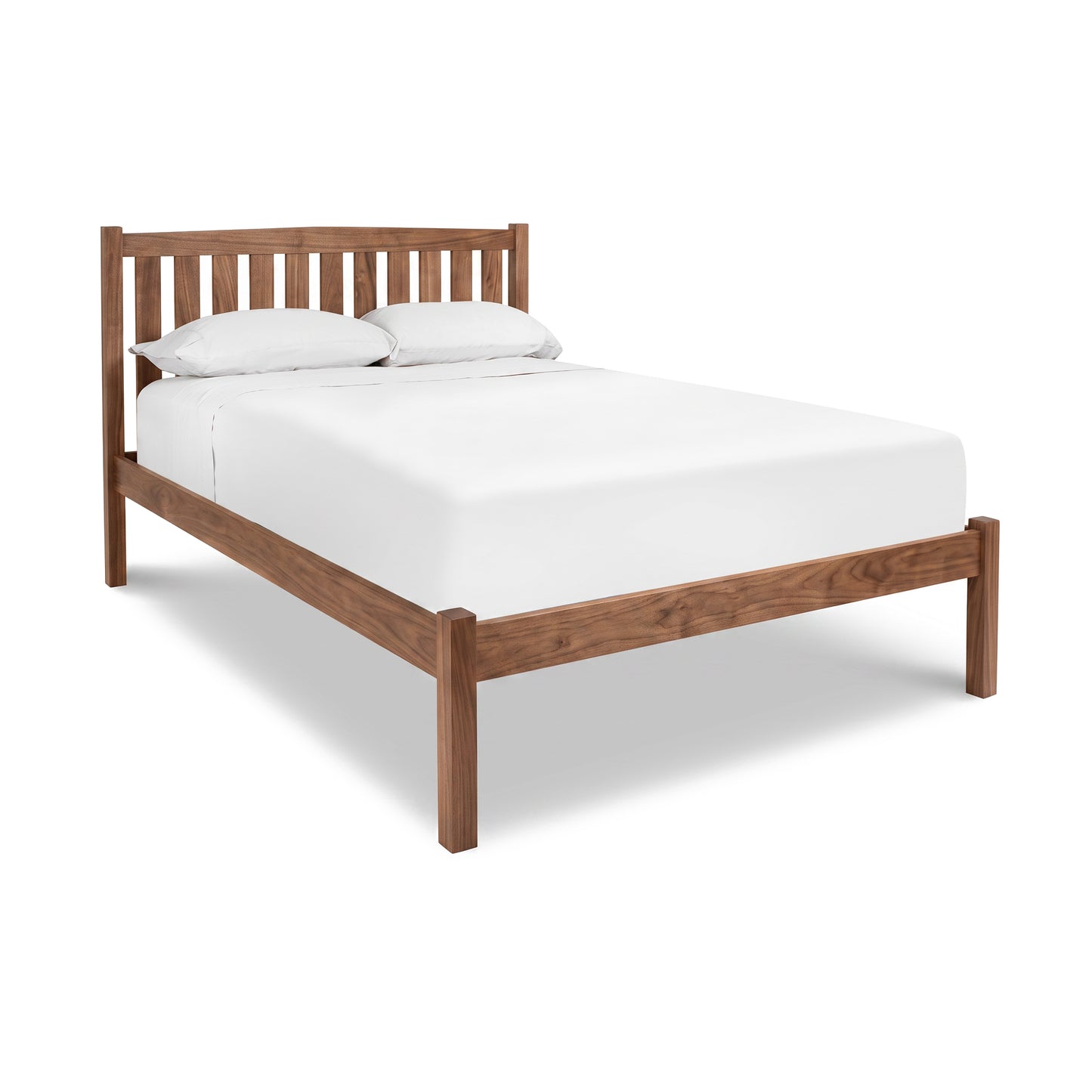 Bennington Bed with Low Footboard by Vermont Furniture Designs featuring a white mattress and pillows, crafted from premium wood.