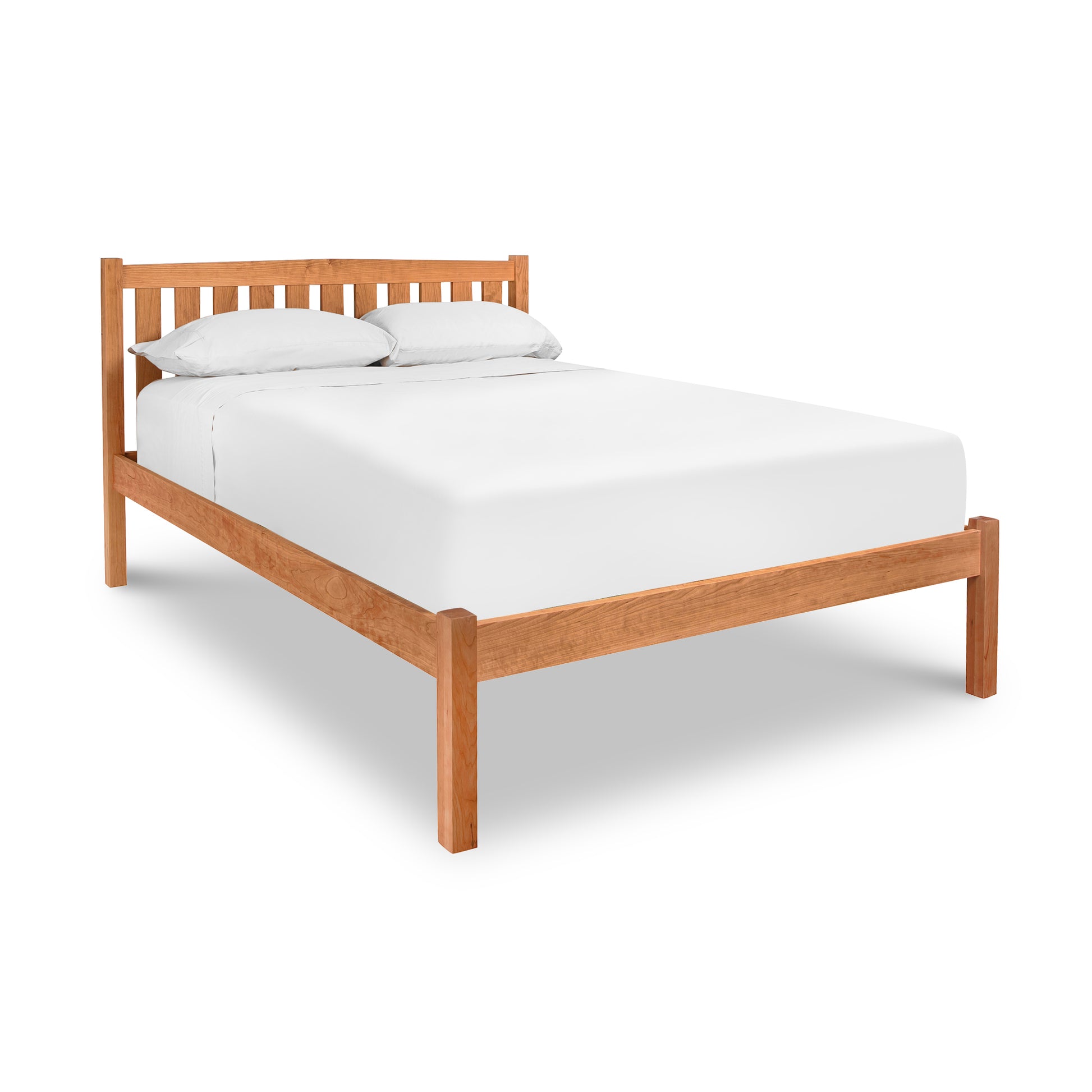 Bennington Bed with Low Footboard by Vermont Furniture Designs, solid wood platform bed featuring a slatted headboard and white bedding.