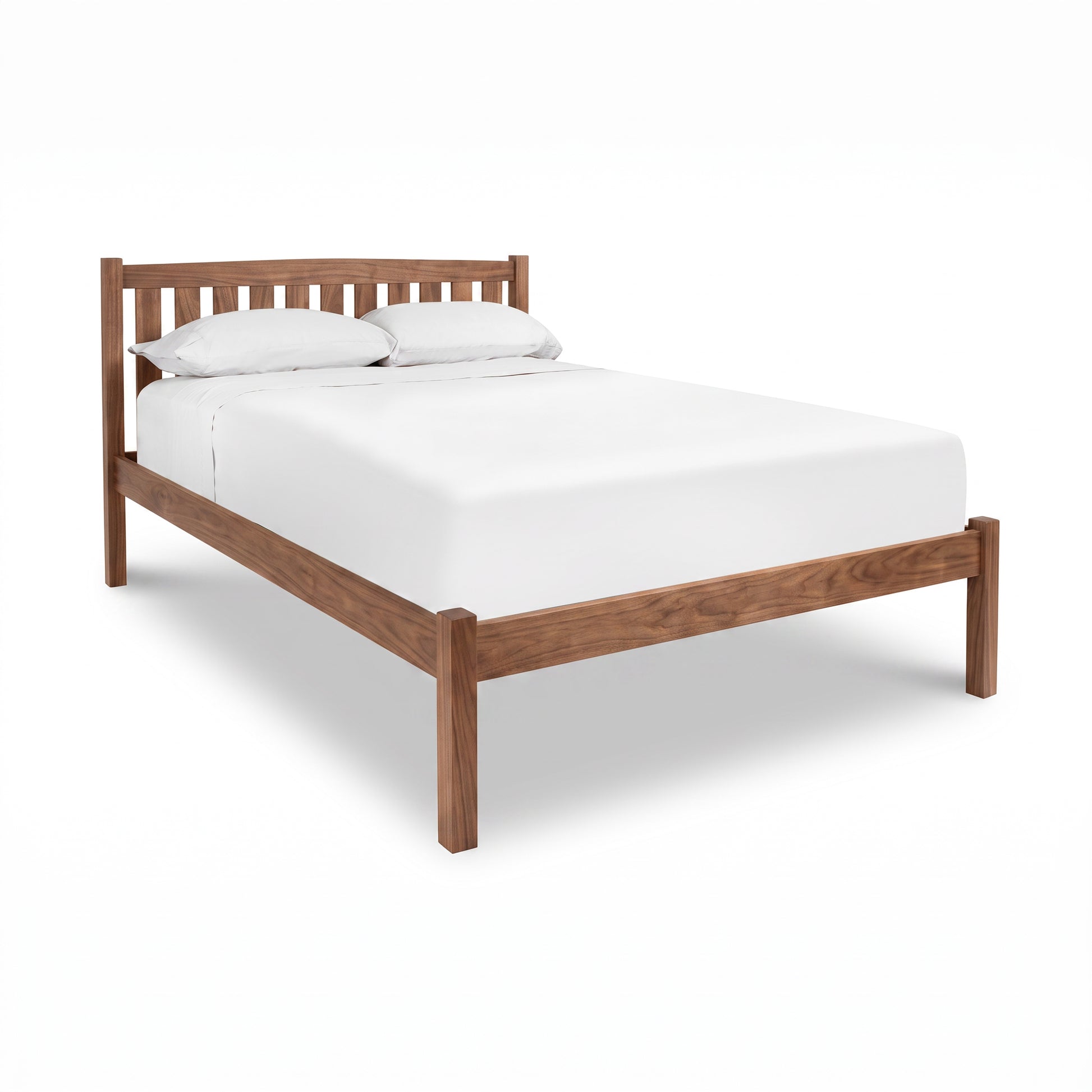 Bennington Bed with Low Footboard by Vermont Furniture Designs, featuring a white mattress and pillows, crafted in solid wood.