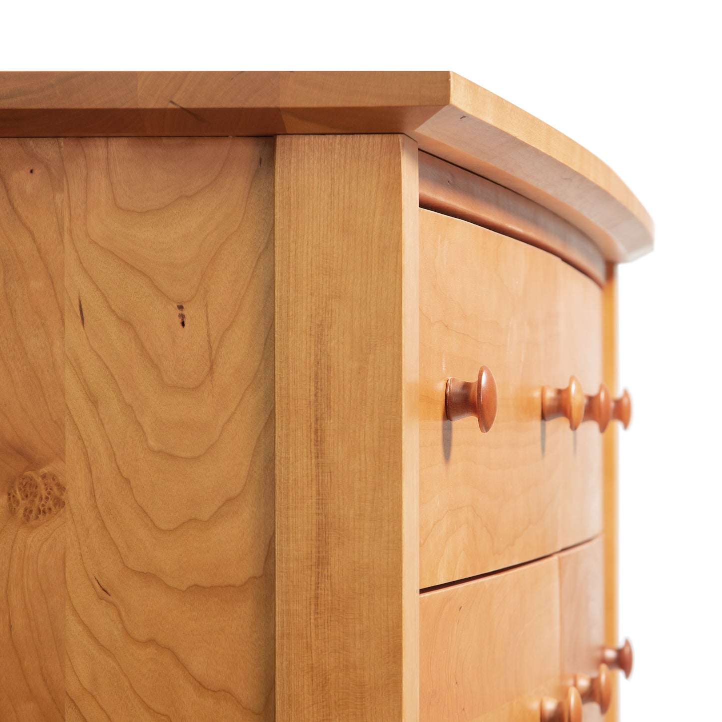 Lyndon Furniture Bow Front 6-Drawer Dresser featuring round wooden knobs and prominent wood grain detailing.