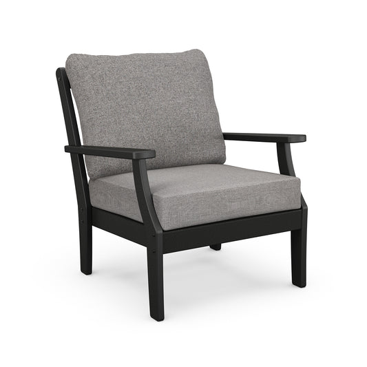 Gray cushioned armchair with black frame similar to the POLYWOOD Braxton Deep Seating Chair.