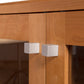 Close-up of Lyndon Furniture Brighton Buffet showcasing solid wood cabinet doors with glass panels and two square silver knobs.