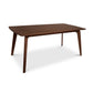 Lyndon Furniture Brighton Solid-Top Table with angled legs and a smooth dark brown finish, showcasing mid-century modern style.