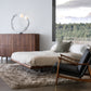 American made, high quality wood bed and matching dresser in a modern bedroom, accented by gray bedding. Furniture by Vermont Woods Studios.