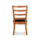 Bromley Ladder-Back Chair by Vermont Woods Studios, crafted from natural wood with black upholstery, displayed from the back.